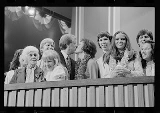 Lillian Carter sits to the left in this family portrait.